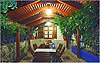 Garden pergola and dining table at night